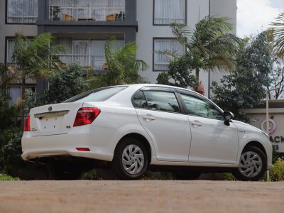 🤍 2018 TOYOTA AXIO HYBRID – PEARL WHITE | 1500CC PETROL-HYBRID • SUPER FUEL-EFFICIENT • COMFORTABLE SEDAN